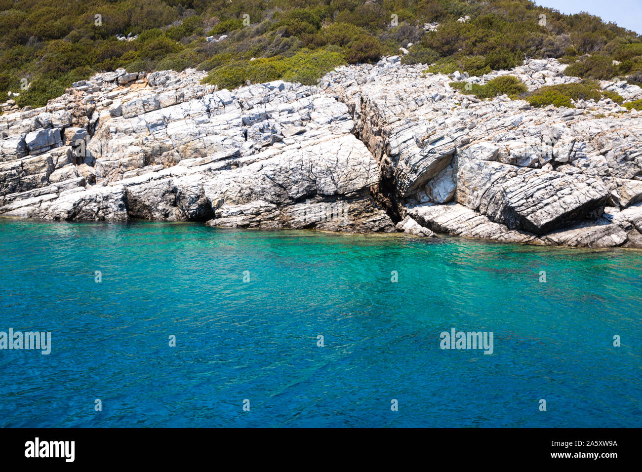 Blue turquoise water of mediterranean sea (aegean sea). Turkey, Bodrum region. Stock Photo