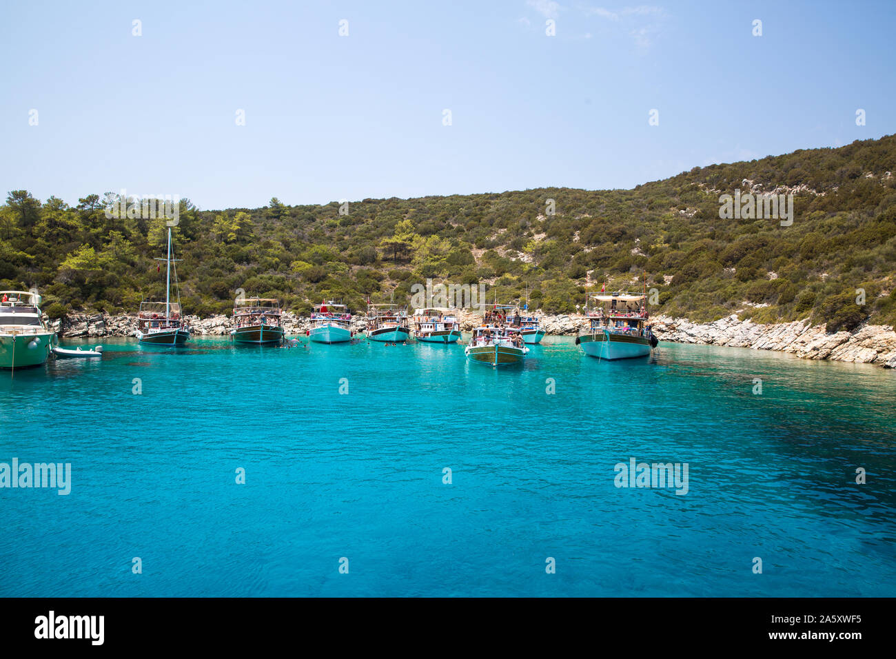 Touristical boats on the bay blue lagoon bay in Mediterranean sea near Turkey, Bodrum, Mugla. Stock Photo