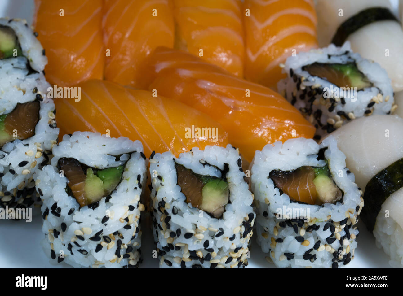 Assortment Of Fresh Sushi Sushi With Salmon Butterfish Rolls With Smoked Salmon Avocado And White And Black Sesame Tasty Fresh Japanese Cuisine Stock Photo Alamy