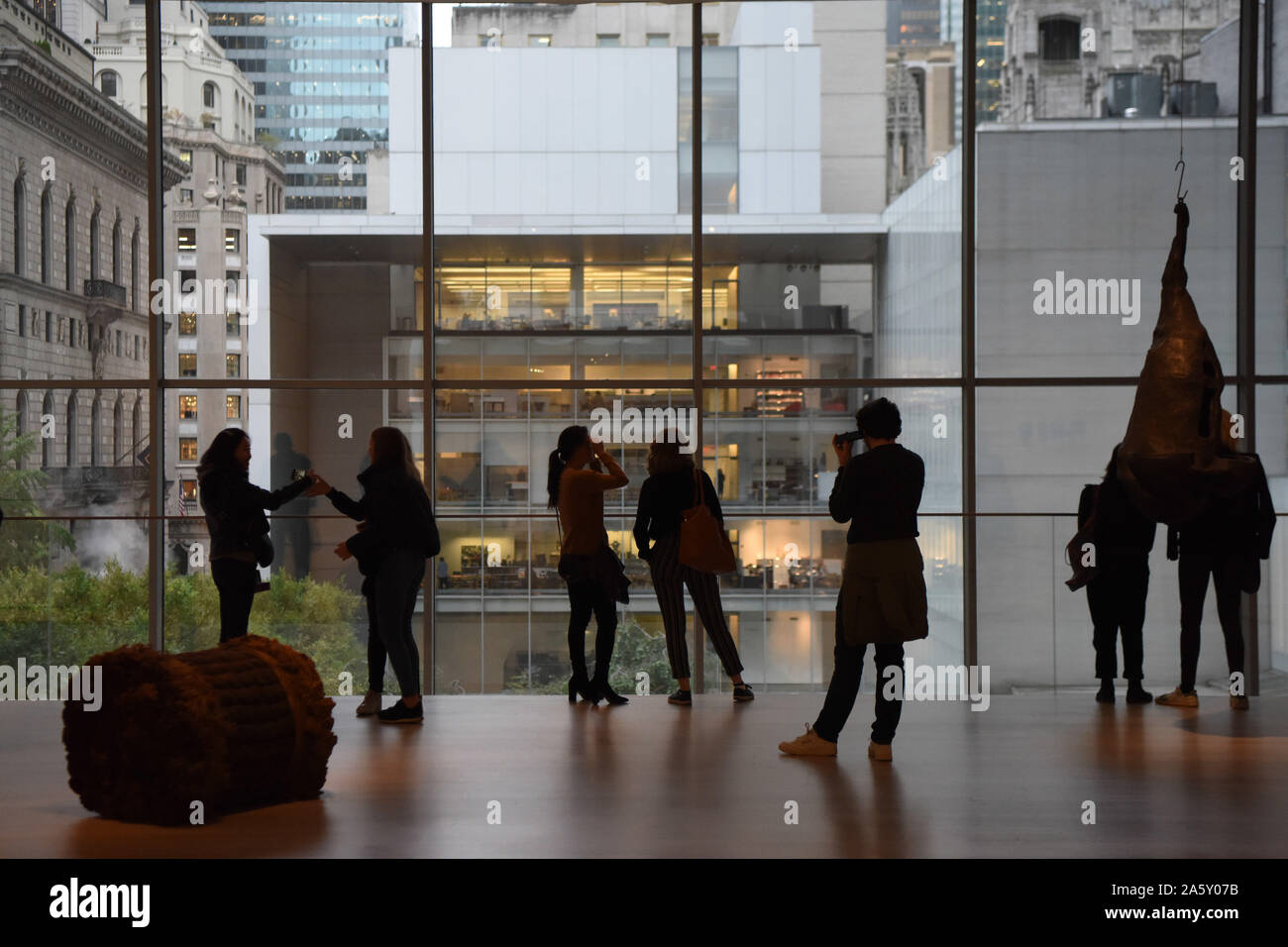 New York, USA. 22nd Oct, 2019. Visitors enjoy the outside in the Museum of Modern Art (MoMA) in Manhattan of New York, the United States, Oct. 22, 2019. MoMA was reopened