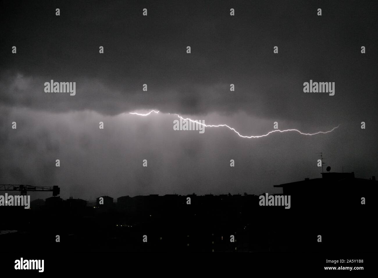 Thunder At Night Time in night sky over the horizon Stock Photo