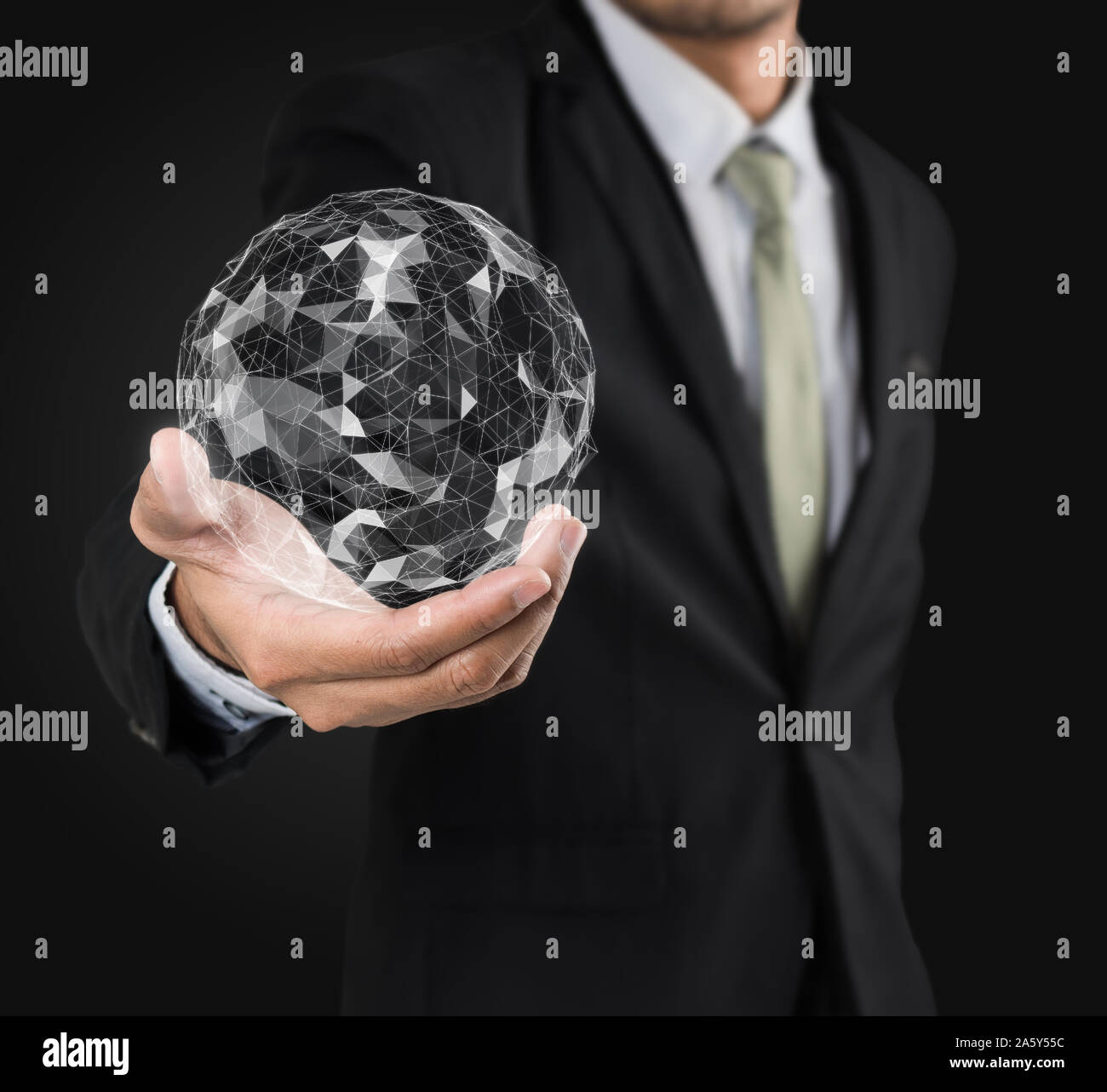 Businessman holding flying earth network connection interface on black background Stock Photo