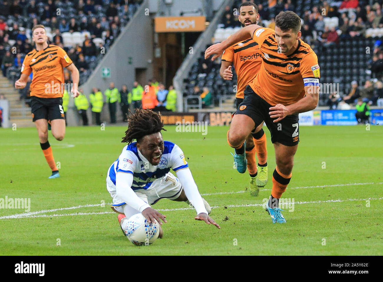 19th October 2019, KC Stadium, Kingston upon Hull, England; Sky Bet Championship, Hull City v Queens Park Rangers : Eberechi Eze (10) of QPR goes down in the penalty area after being fouled by Eric Lichaj (2) of Hull City  Credit: David Greaves/News Images Stock Photo