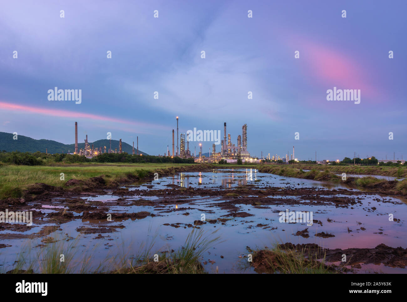 Oil petrochemical refinery plant at sunset twilight Stock Photo - Alamy