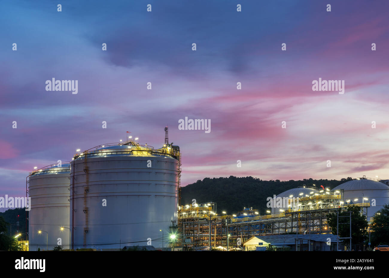 Oil petrochemical refinery plant at sunset twilight Stock Photo - Alamy