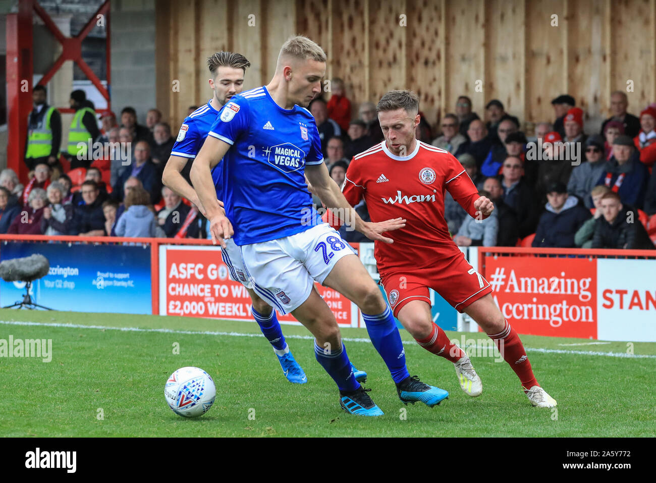 20th October 2019, The Wham Stadium, Accrington, England; Sky Bet League 1, Accrington Stanley v Ipswich Town : Jordan Clark of Accrington Stanley slips the ball past Luke Woolfenden of Ipswich Town before crossing the ball into the box  Credit: Mark Cosgrove/News Images Stock Photo