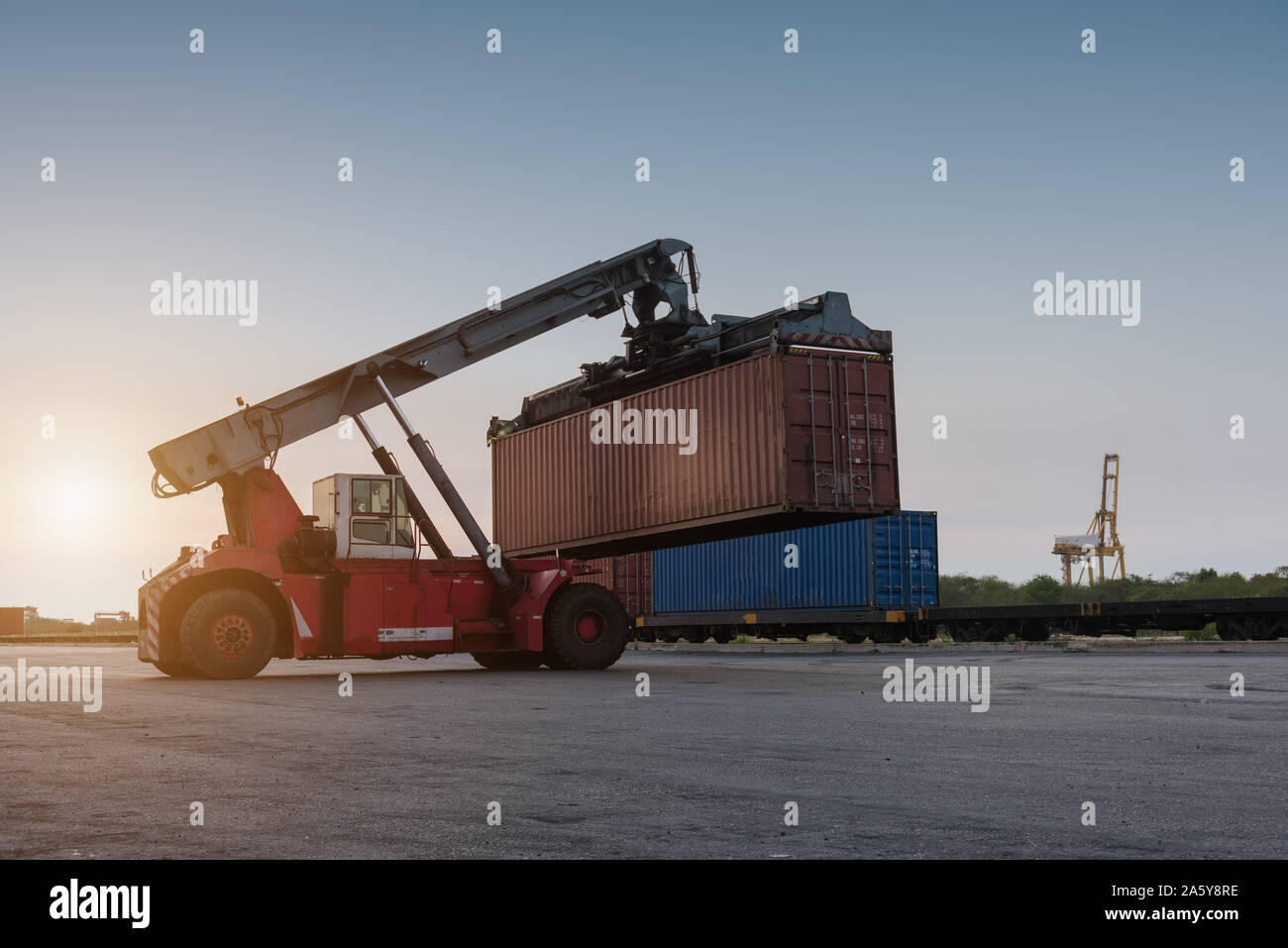 forklift handling holding container box at harbor logistic zone Stock ...