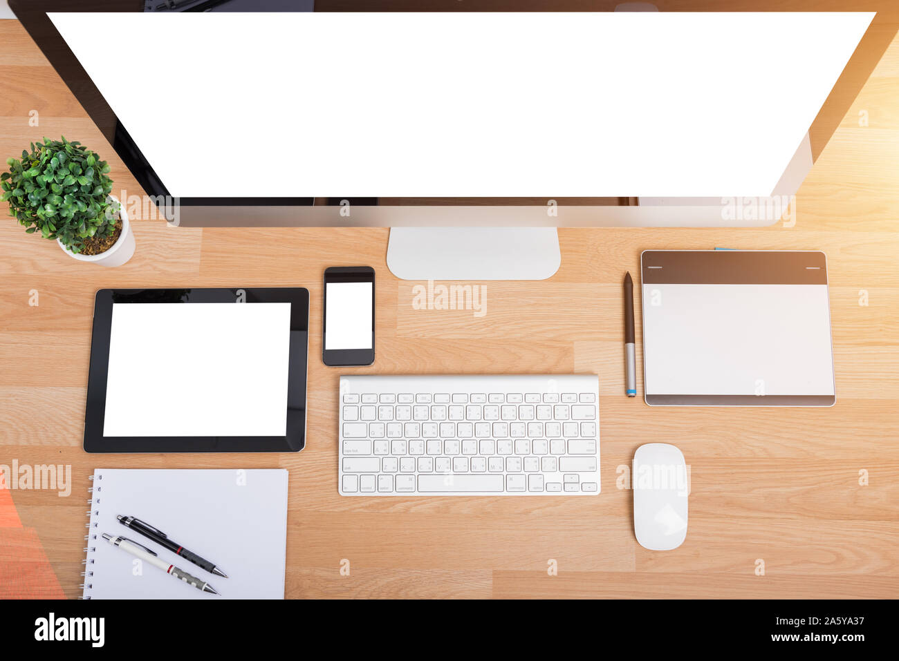 Top view monitor computer PC, keyboard, Phone, magic mouse and tablet