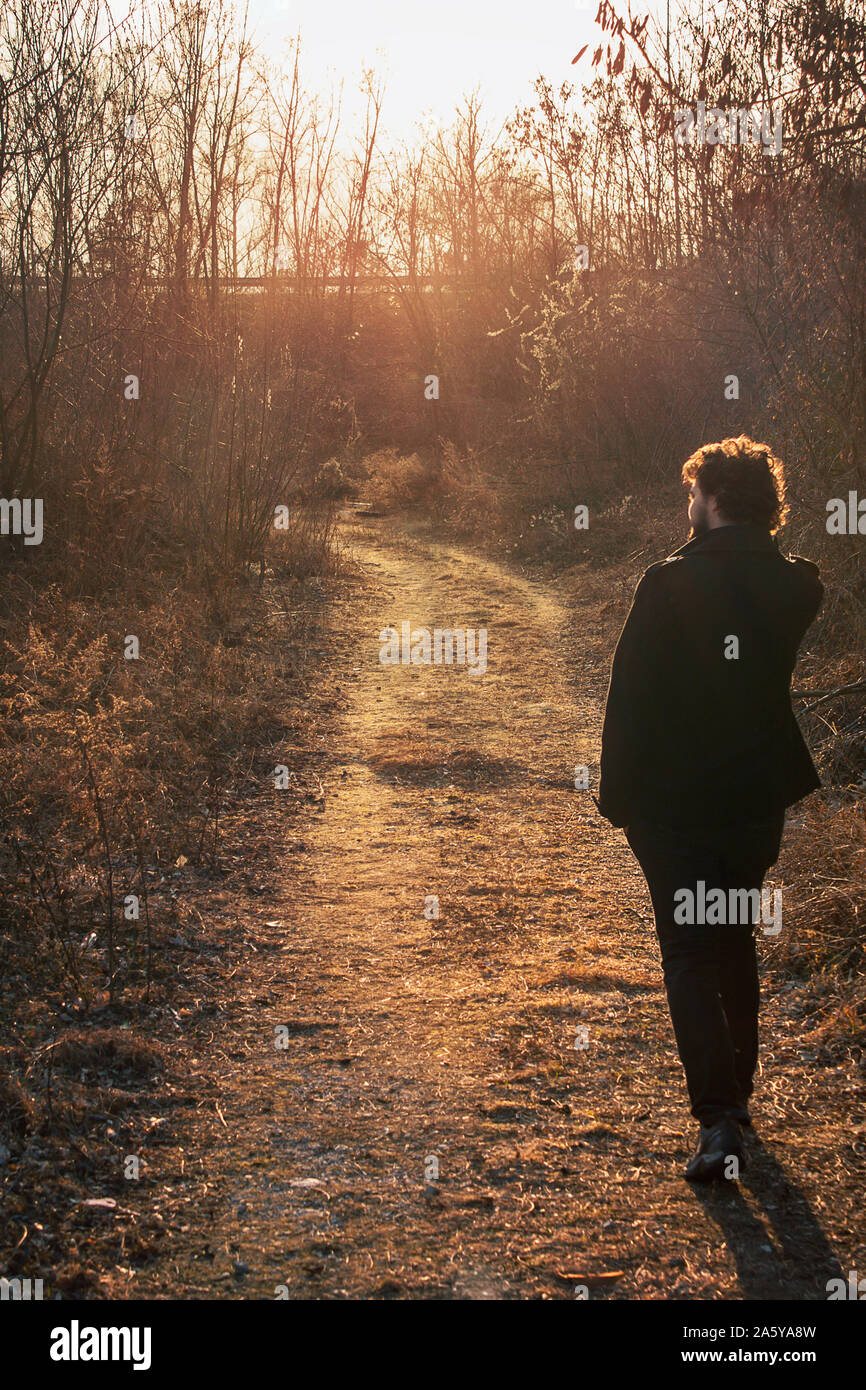 Mysterious Man Walking Alone Lonely Person Walks Through A Forest In Abandoned Places Near The City Back View The Face Is Not Recognizable Stock Photo Alamy Mysterious Man Walking Alone Lonely Person Walks Through A Forest In Abandoned Places Near The City Back View The Face Is Not Recognizable Stock Photo Alamy
