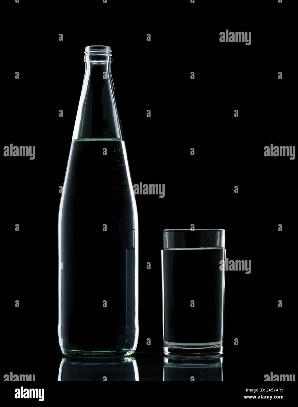 Download Bottle And Glass Water Clear Isolate On Over Black Background Stock Photo Alamy PSD Mockup Templates