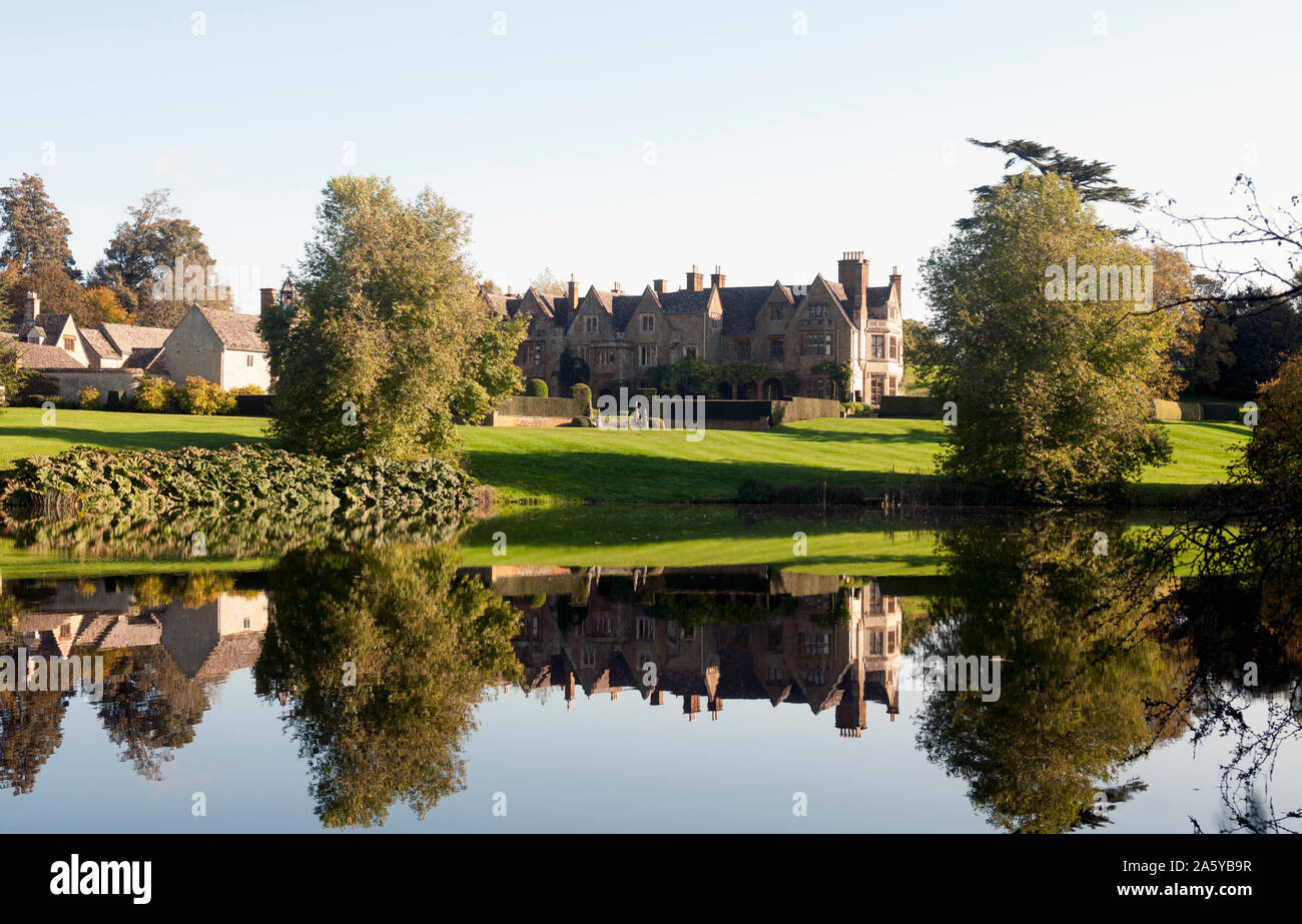 Barton Abbey seen across the lake, Steeple Barton, Oxfordshire, England