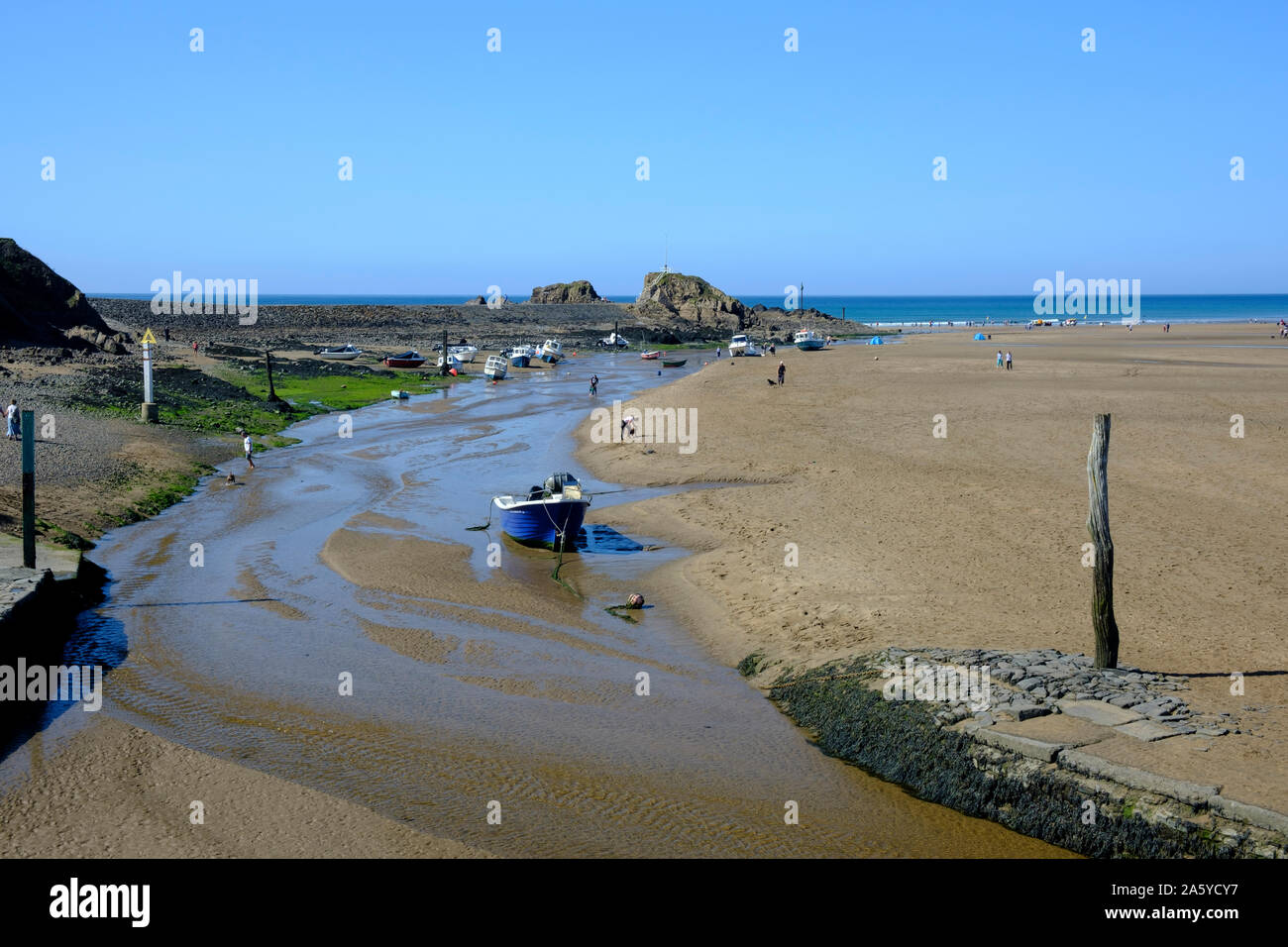 View of the beach in Bude with Bude Canal coming to an end at the Sea Lock Bude Cornwall England Stock Photo