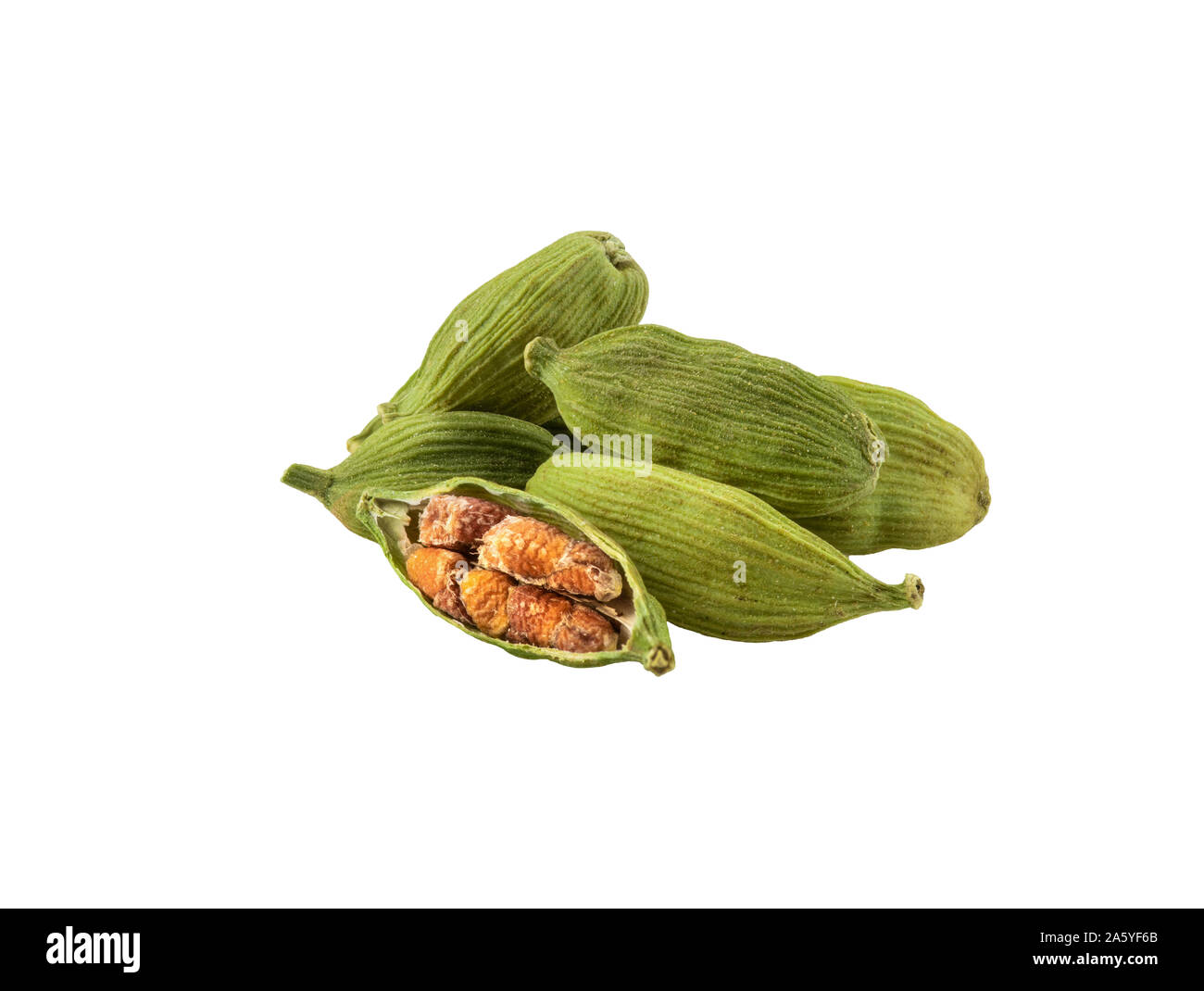 Handful of a green cardamon pods with seeds isolated on white