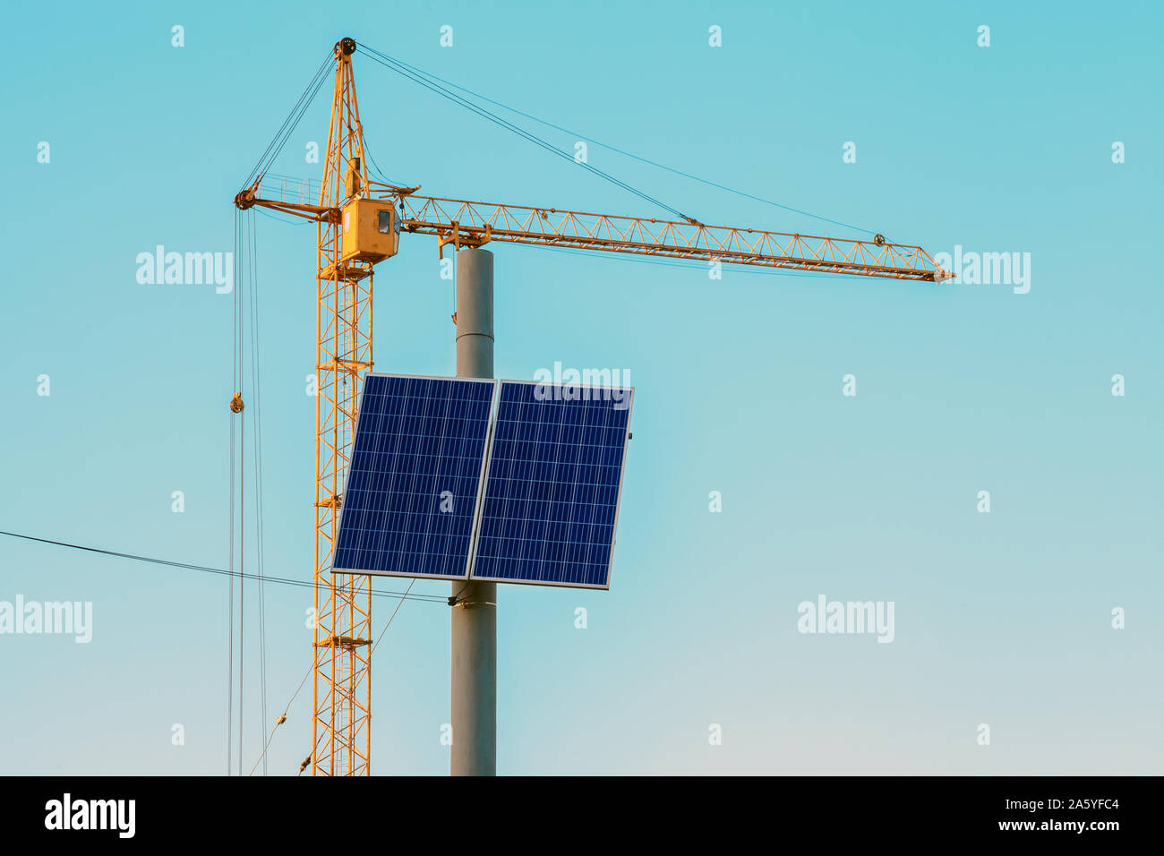 Solar panel on top electric pole by blue sky. Small photovoltaic panel ...