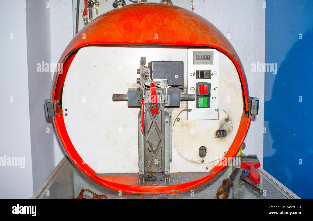 Key duplication machine at work. Retro style Stock Photo - Alamy