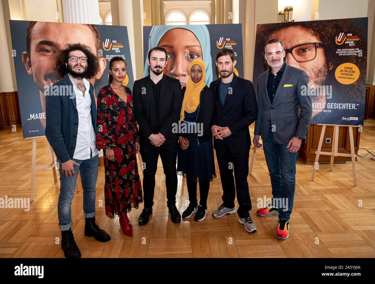 Berlin, Germany. 23rd Oct, 2019. Ramy Al-Asheqs (l-r), nominee for the  award, Sawsan Chebli, Berlin State Plenipotentiary and State Secretary for  Civic Engagement and International Affairs, Beslan Kabartai, nominee for  the award,