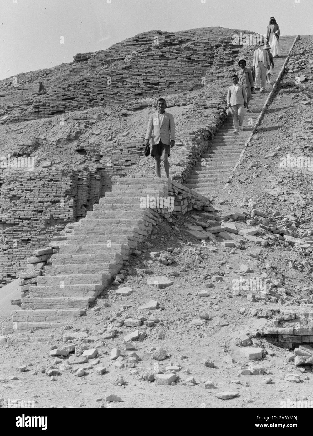 The reconstructed staircase of the Neo-Sumerian Great Ziggurat of Ur, near Nasiriya, Iraq. Ziggurats were built by the Sumerians, Babylonians, Elamites, Acadians, and Assyrians for local religions. Each ziggurat was part of a temple complex which included other buildings. The precursors of the ziggurat were raised platforms that date from the Ubaid period, during the fourth millennium BC. Stock Photo