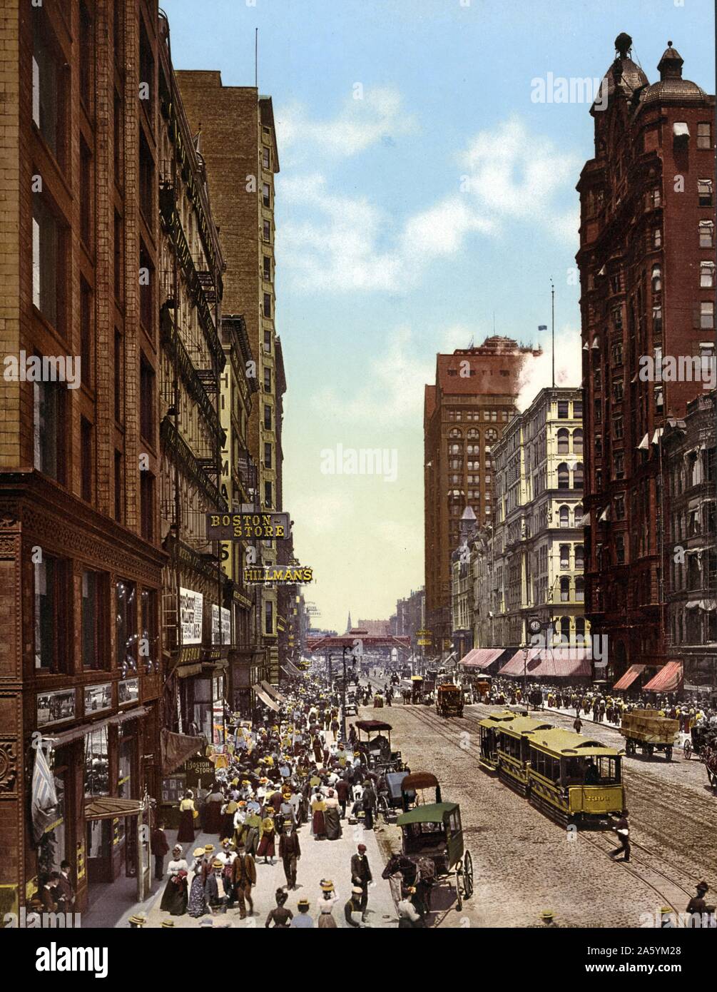 State Street north from Madison Street, Chicago, Illinois, 1900 USA; showing horses and wagons hitched to rails on the side street. Stock Photo