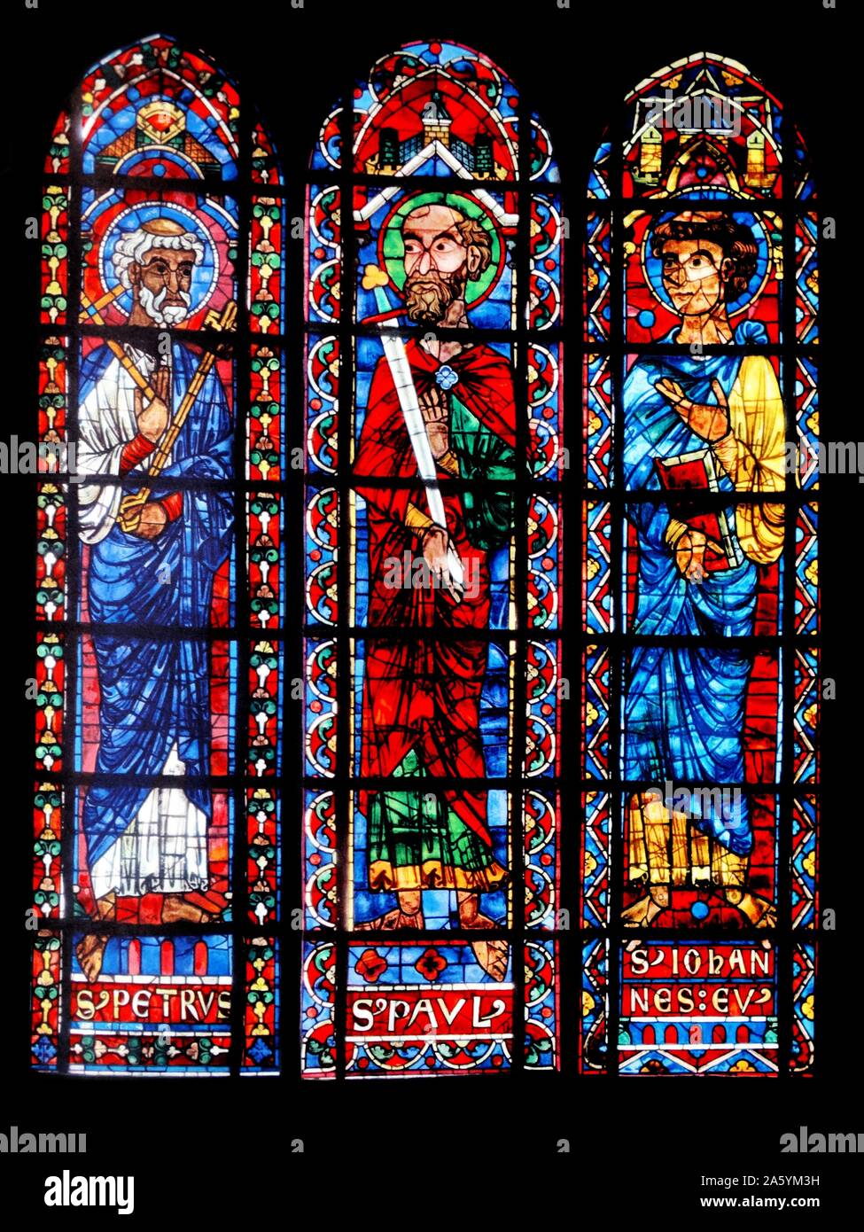 Stained glass windows from Bourges Cathedral, France. Shows the Apostles; Peter, Paul and John; 13th century Stock Photo