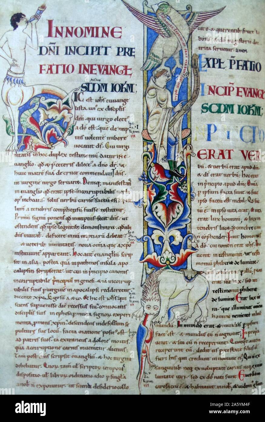 Part of Stephen Harding's Bible. The 'I' of 'In principo', formed by St John (in the white habit of a Cistercian) and his eagle , which is shown digging it's talons into his eyes, nose, mouth and ears, symbolising the word of God being imprinted upon his senses. An example of Cistercian art. Dated 12th Century Stock Photo