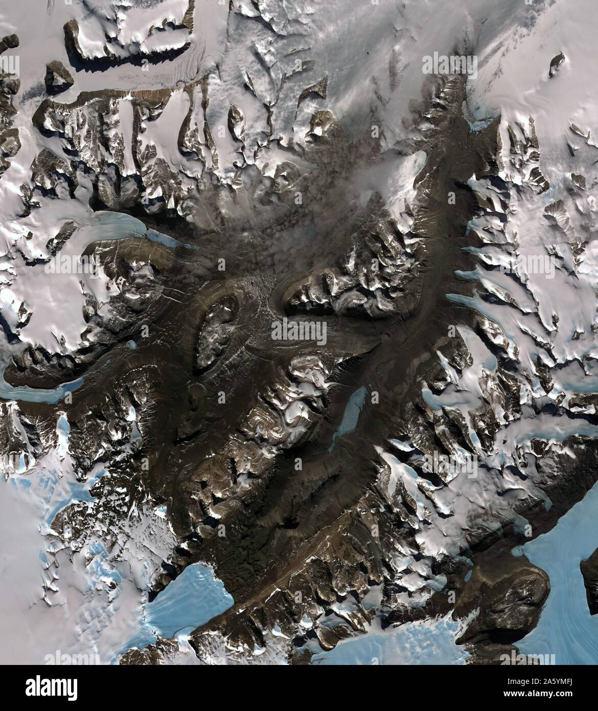 The McMurdo Dry Valleys are a row of valleys west of McMurdo Sound, Antarctica. They are so named because of their extremely low humidity and lack of snow and ice cover. December 8, 2002. Satellite image. Stock Photo