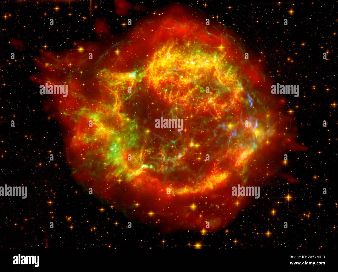 The many sides of the supernova remnant Cassiopeia A. Located 10,000 light-years away in the northern constellation Cassiopeia, Cassiopeia A is the remnant of a once massive star that died in a violent supernova explosion 325 years ago. Hubble Space Telescope (HST), Spitzer Space Telescope. Stock Photo
