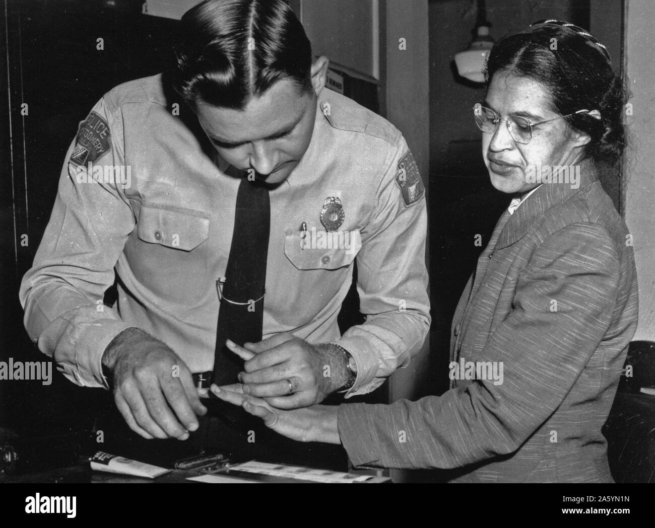 Rosa Parks is fingerprinted by police Lt. D.H. Lackey in Montgomery 1956. Stock Photo