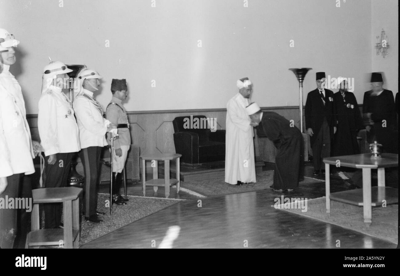 24th anniversary of Arab revolt under King Hussein & Lawrence 1940. The Emir receiving the Islamic religious officials, officers of the Arab Legion on the left Stock Photo
