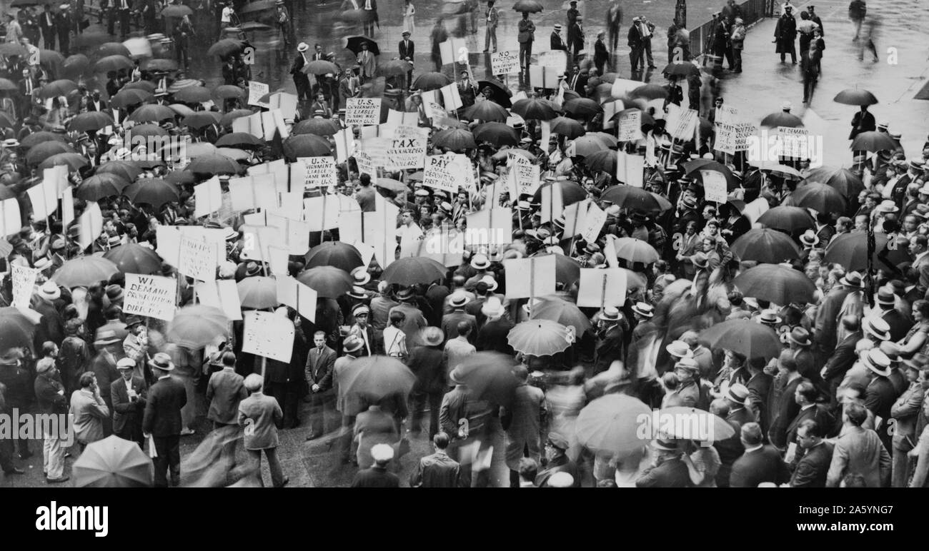 Crowd of depositors gather in the rain outside the Bank of United States after its failure. 1931. Stock Photo