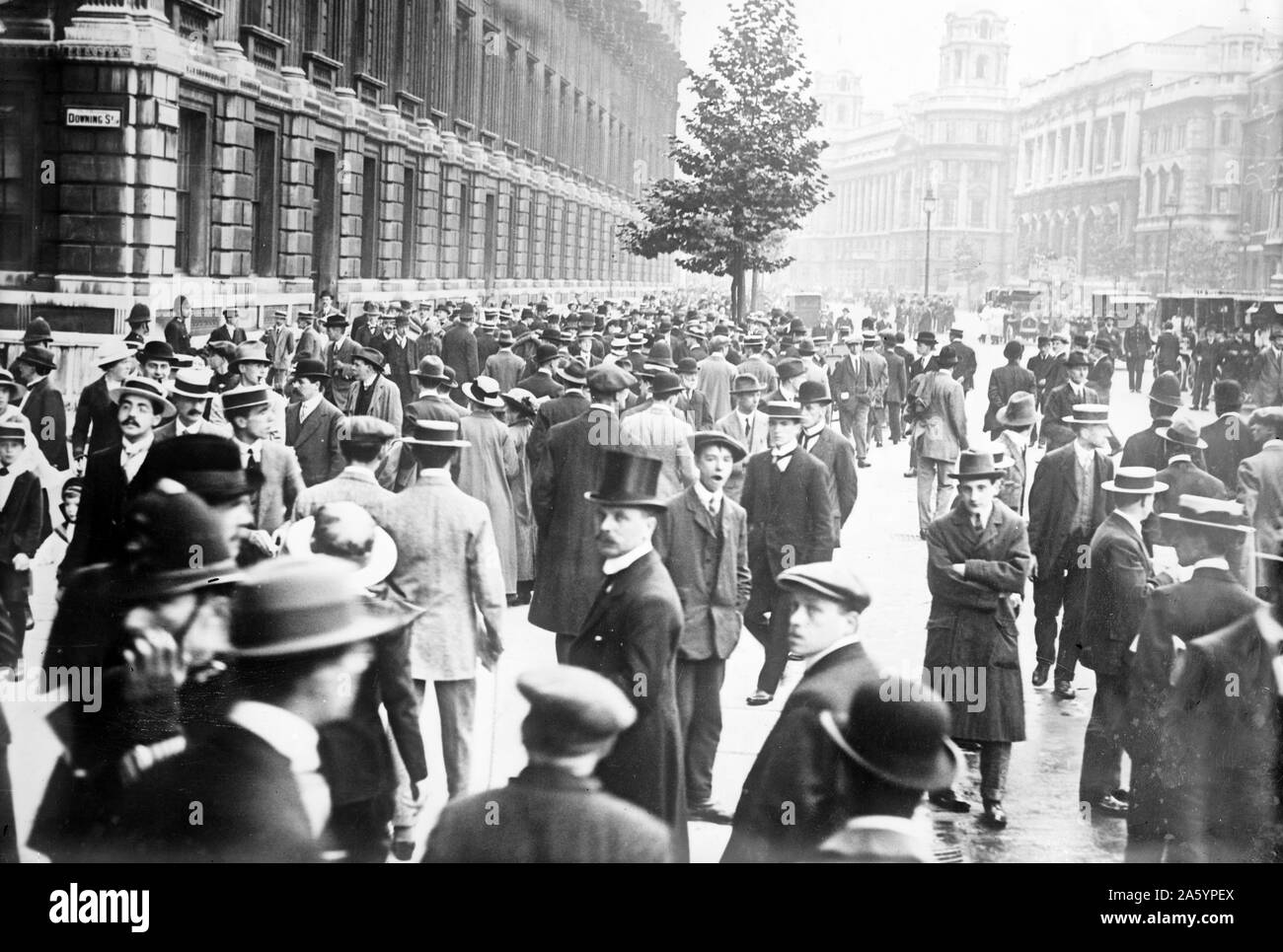Announcement of World War One commencement as a crowd gathers near Downing St., London 1914 Stock Photo