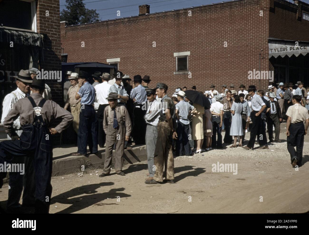 Farmers and townspeople in the centre of town on Court Day, Campton, Kentucky by photographer Marion Post, Wolcott (1914-1997). Colour. in September 1940. Stock Photo