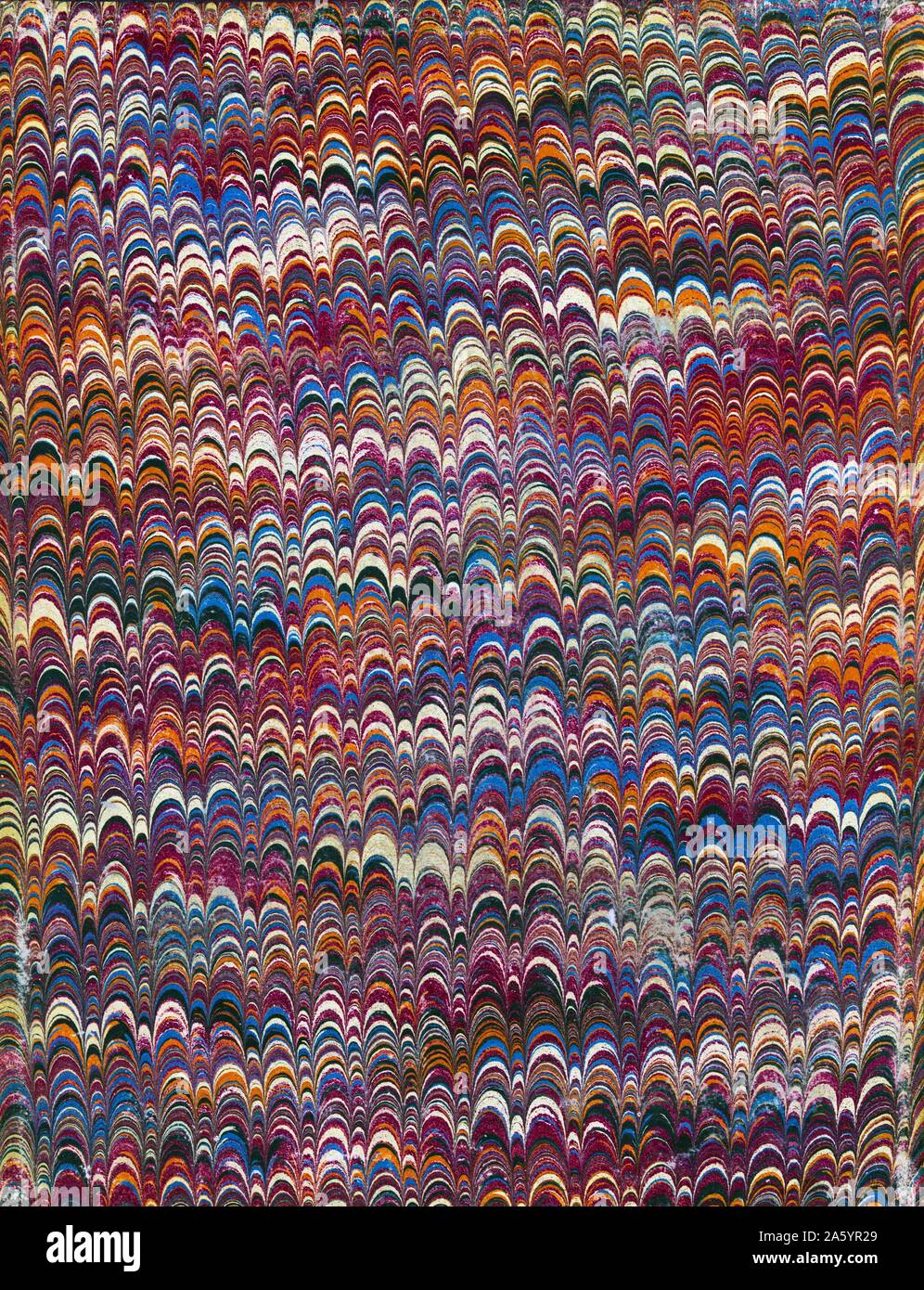 Marbled design used for an end paper on the inside cover of a mid 19th century American book Stock Photo