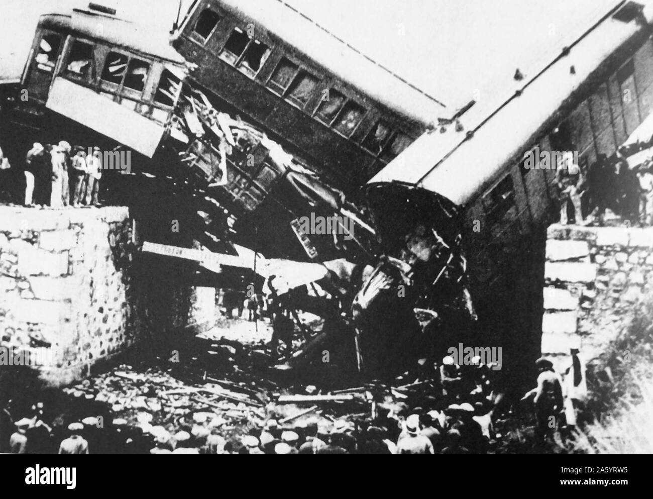 Wreckage of a train on the Seville to Barcelona route 1936. The train has derailed after a terrorist explosion attributed to communists. Stock Photo