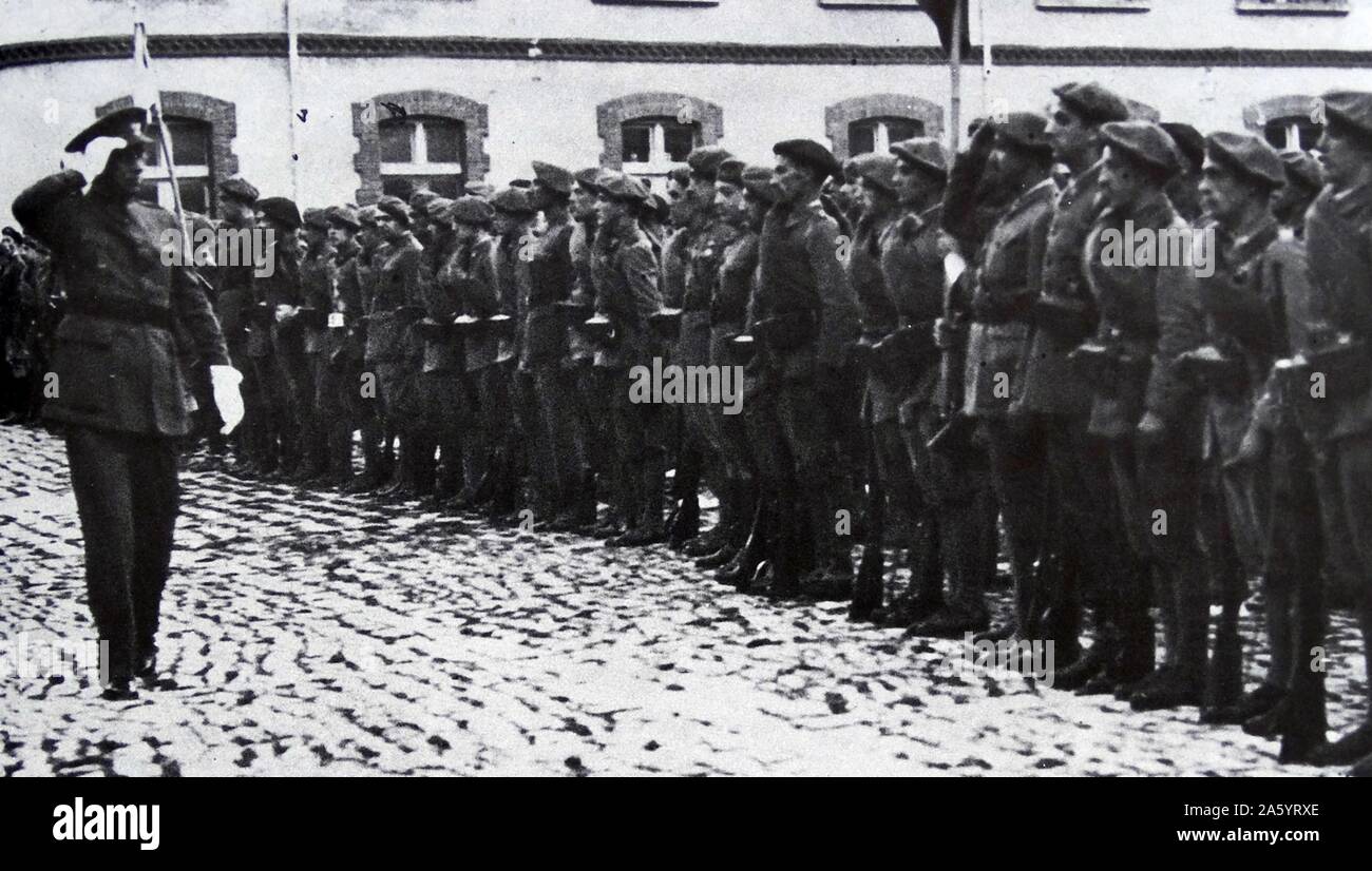 General Don Emilio Mola y Vidal, 1st Duke of Mola, (1887 – June 3, 1937) reviews nationalist troops during the Spanish Civil War. He led the military uprising that culminated in the Spanish Civil War. Stock Photo