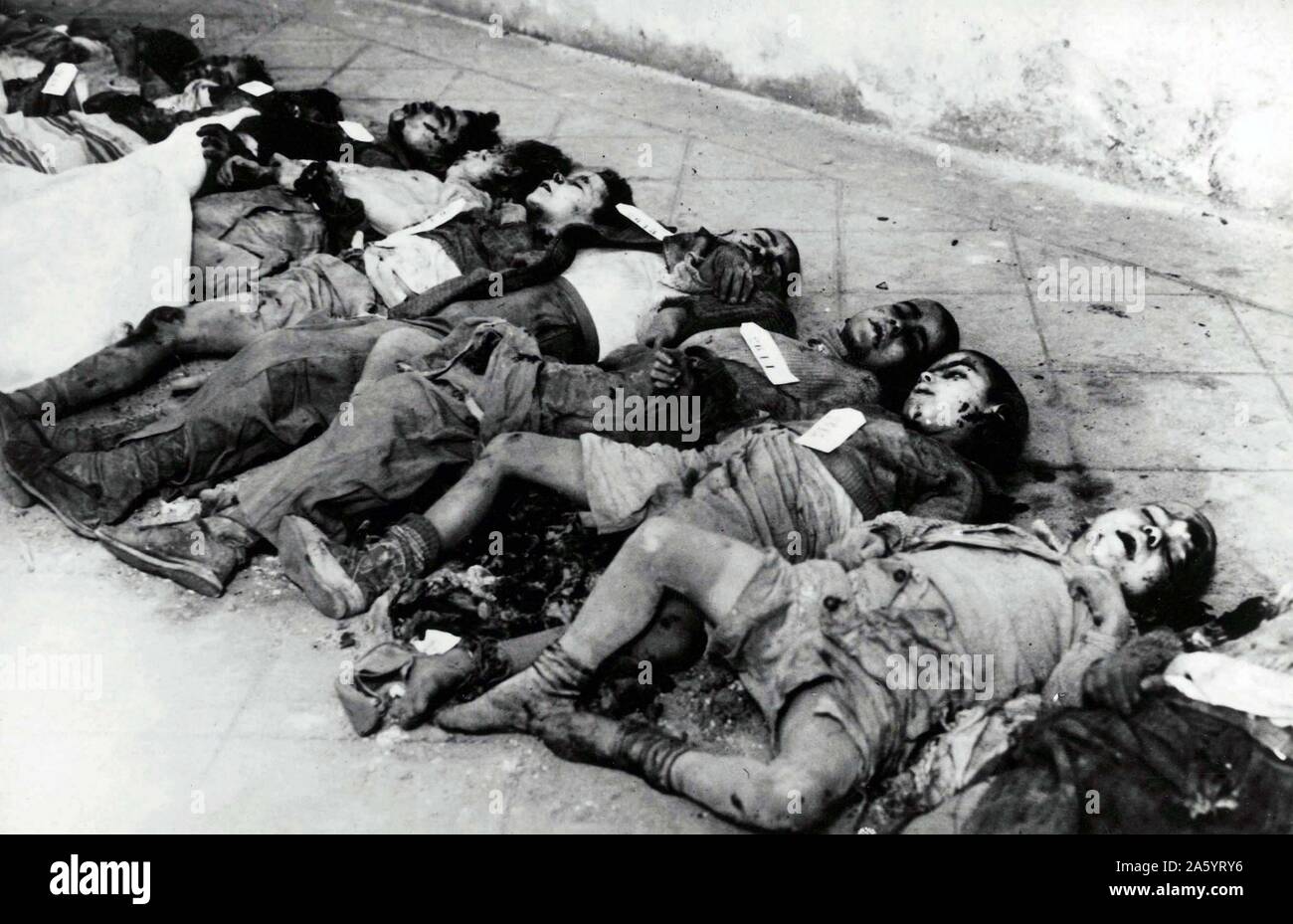 On a street in Barcelona are the bodies of some young children killed byan Italian air raid during the Spanish Civil War. March 1938. Stock Photo