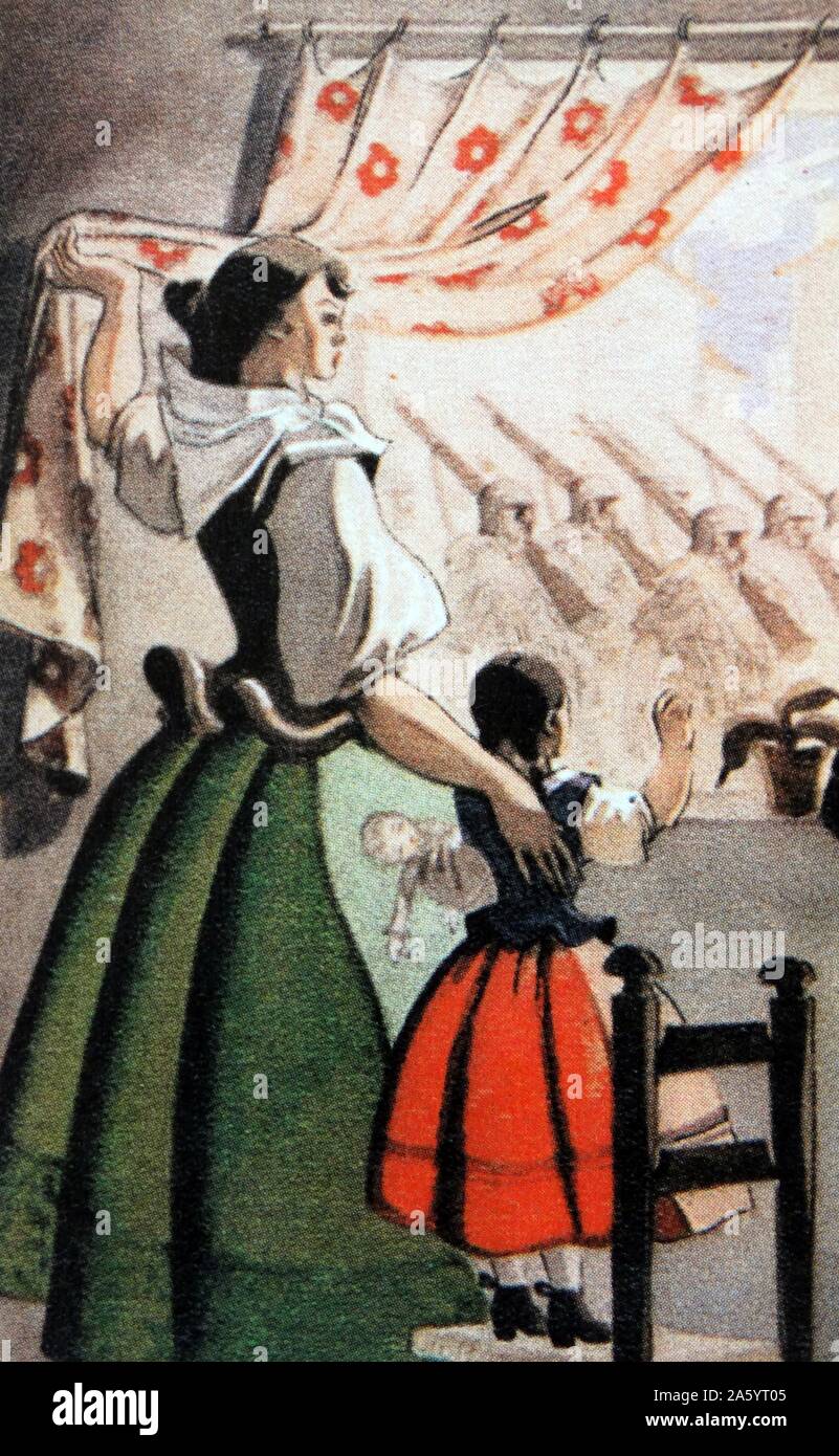 A Falangist (pro-fascist) post card from the Spanish Civil War period extolls the role of women as mothers watching their menfolk go to fight Stock Photo