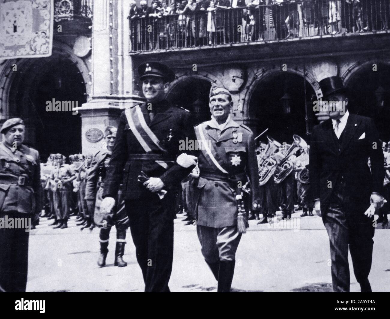 Pedro Teotónio Pereira Portuguese ambassador to Spain walks with Nationalist Spanish general Millán-Astray in Salamanca, and (right) Nicolas Franco, during the Spanish civil war. José Millán-Astray y Terreros (1879 – 1954) Spanish soldier, the founder and first commander of the Spanish Foreign Legion. Pedro Teotónio Pereira (1902 – 1972) Portuguese diplomat. played a decisive role, helping the allies, in drawing Spain with Portugal into a neutral bloc during World War II. Nicolás Franco (1891 - 1977)Spanish soldier and politician; brother of Francisco Franco, Stock Photo