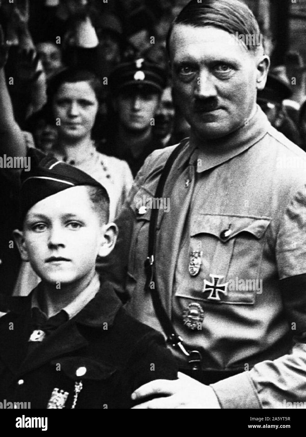 Adolf Hitler 1889-1945, German Nazi leader, seen standing with a young Hitler Youth Member 1934 Stock Photo