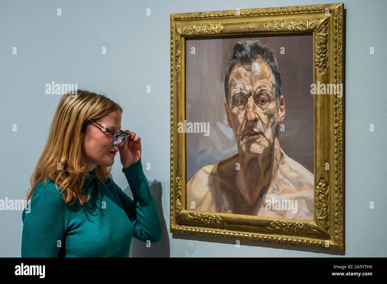 London, UK. 23rd Oct, 2019. Reflection, self portrait, 1985 - Lucian Freud self-portraits at the Royal Academy of Arts. Executed over almost seven decades on canvas and paper, the exhibition brings together 56 works that chart Freud’s artistic development. Credit: Guy Bell/Alamy Live News Stock Photo