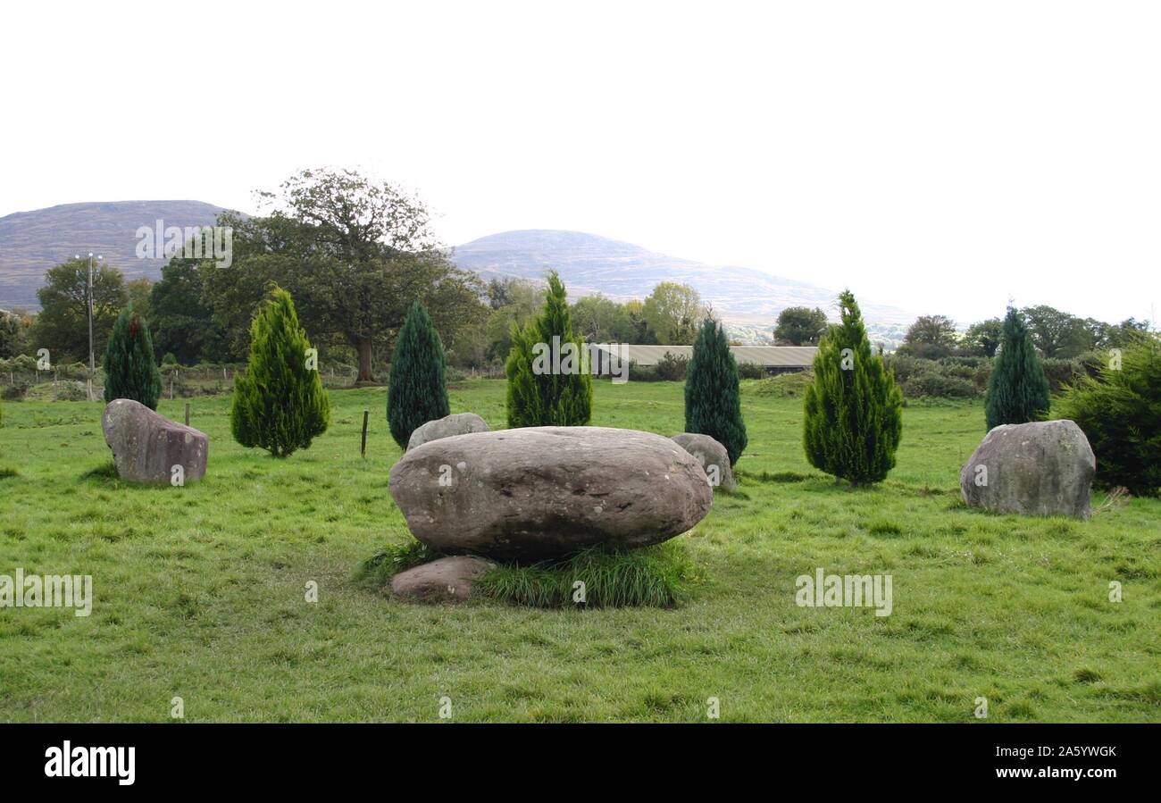 Kenmare, Ireland; One of the largest stone circles in the south-west of Ireland, going back to the Bronze Age (2, 200–500 B.C), when it was constructed. The circle has 15 stones around the circumference with a boulder dolmen in the centre. Stock Photo