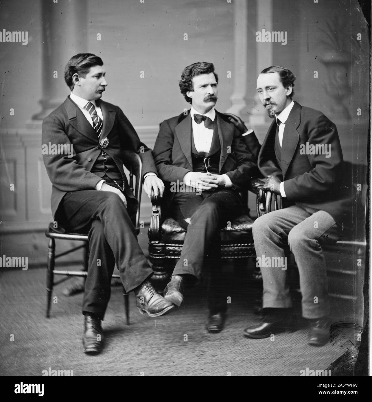 Mark Twain (Samuel L. Clemens) [center] George Alfred Townsend on [his] right, David Gray on [his]left Stock Photo