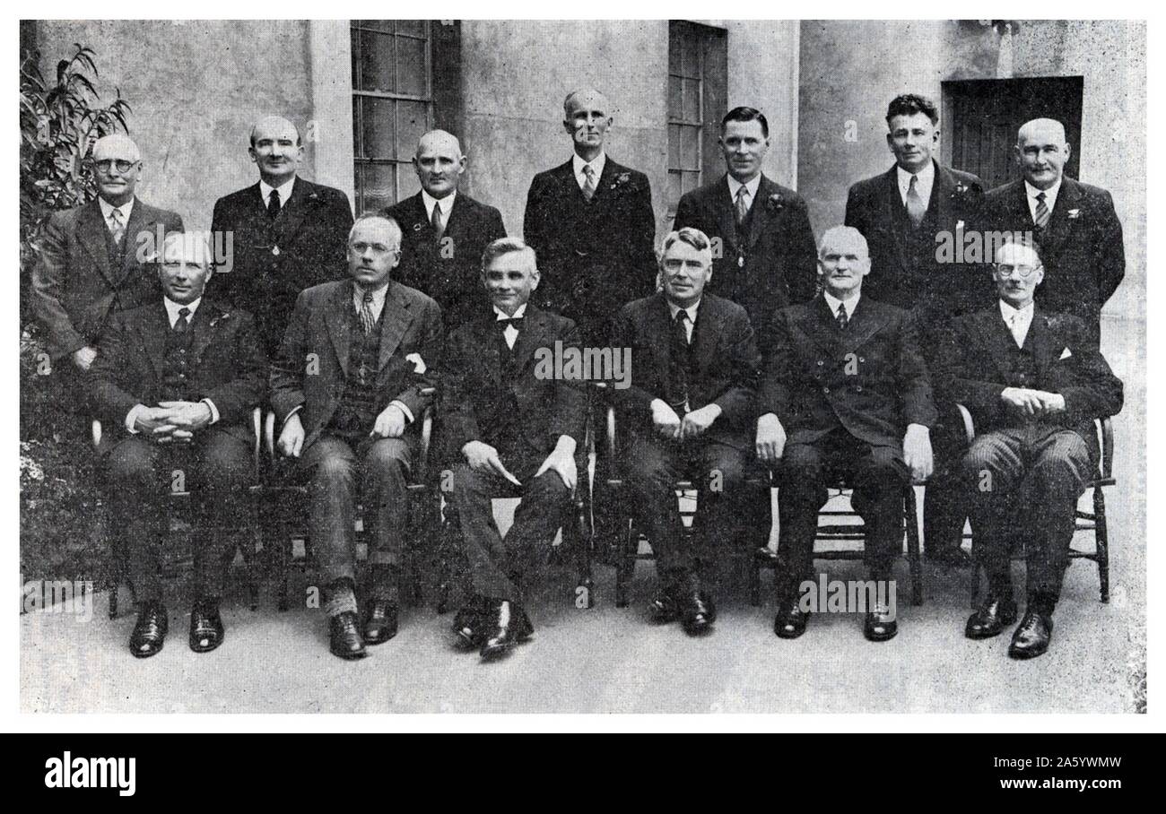New Zealand: the first Labour Government 1935. Back Row: W. Lee Martin (Minister of Agriculture); P. C. Webb (Minister of Mines); F. Langstone (Minister of Lands); H. G. R. Mason (Attorney-General, Minister of Justice); F. Jones (Postmaster-General); D. G. Sullivan (Minister of Industries and Commerce); H. T. Armstrong (Minister of Employment). Front Row: W. E. Parry (Minister of Internal Affairs); P. Fraser (Minister of Education); M. J. Savage (PRIME MINISTER); W. Nash (Minister of Finance); M. Fagan, M.L.C. (Leader of Legislative Council); R. Semple (Minister of Works). Stock Photo