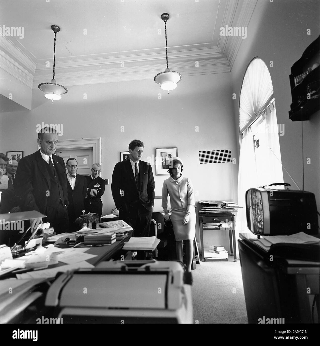 Photograph of President John F. Kennedy and First Lady Jacqueline Kennedy watching flight of Astronaut Alan Shepard on television. Dated 1961 Stock Photo