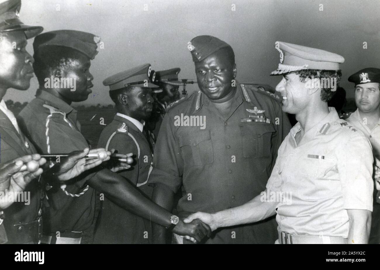 Idi Amin Dada (c. 1925 – 16 August 2003) Centre with Muammar Gaddafi c.?1942 – 2011, Libyan revolutionary who governed Libya as its leader from 1969 to 2011. Amin was President of Uganda, from 1971 to 1979. Stock Photo
