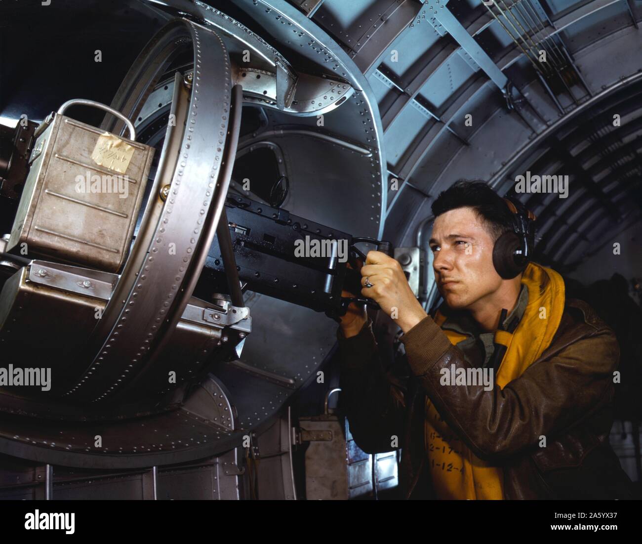 American airman using a a side machine gun of a B-17 Flying Fortress bomber, May 1942. World war two Stock Photo