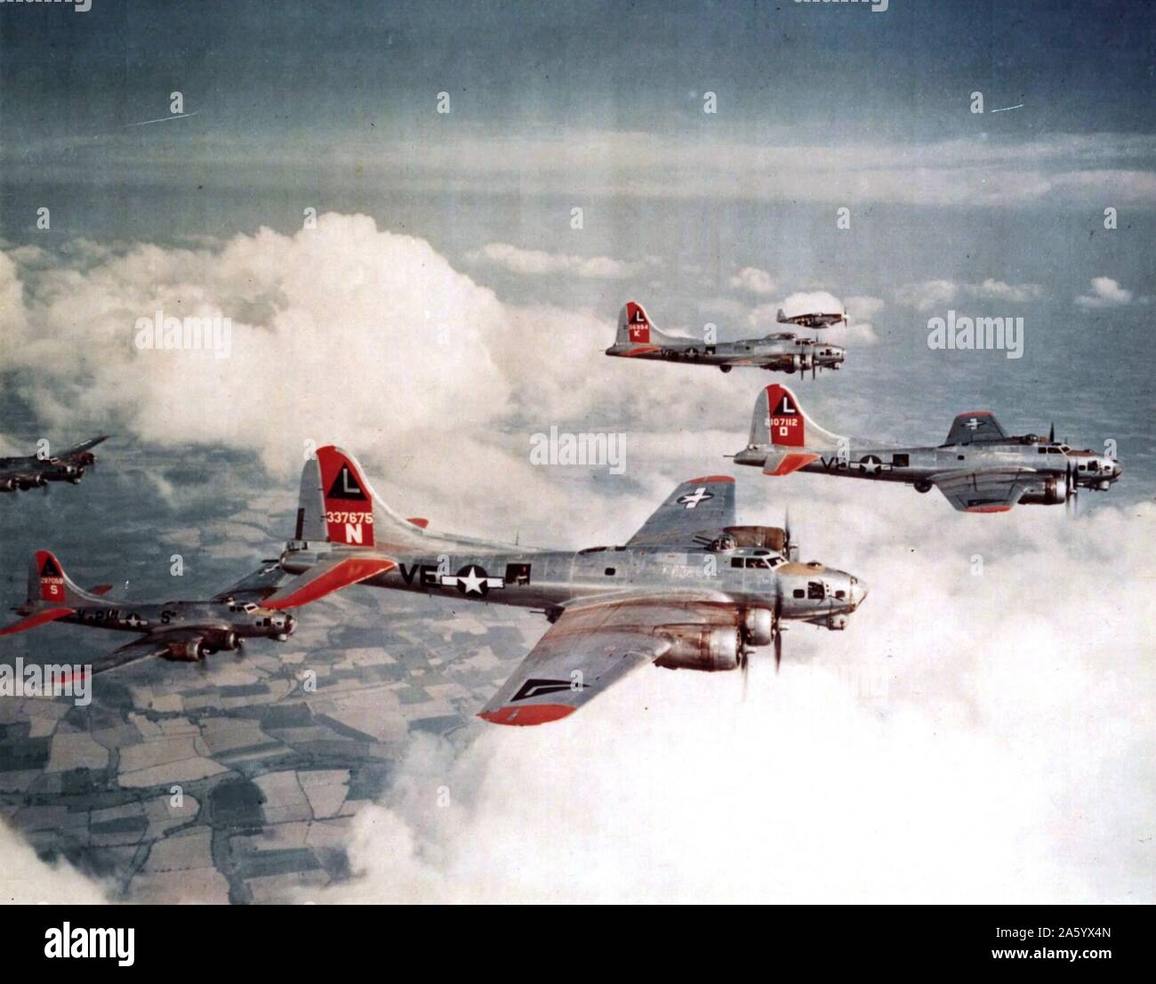 USAF B-17G Fortresses aircraft, of the 381st Bomb Group, escorted by a P-51BC of the 359th Fighter Group, World War two,1944 Stock Photo