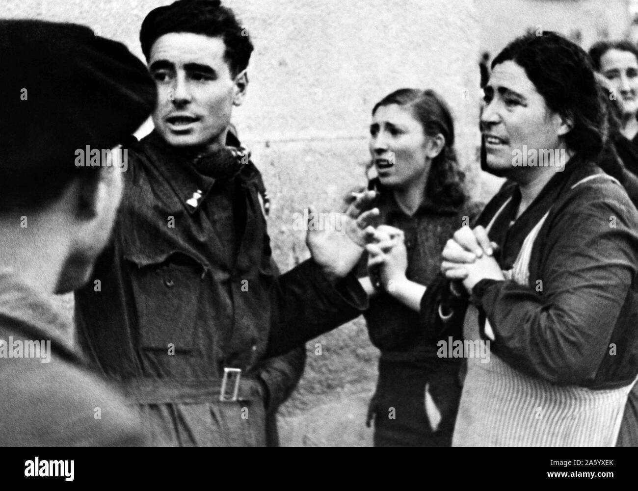Photograph of the relatives of those trapped during an aerial attack in Madrid. Dated 1941 Stock Photo