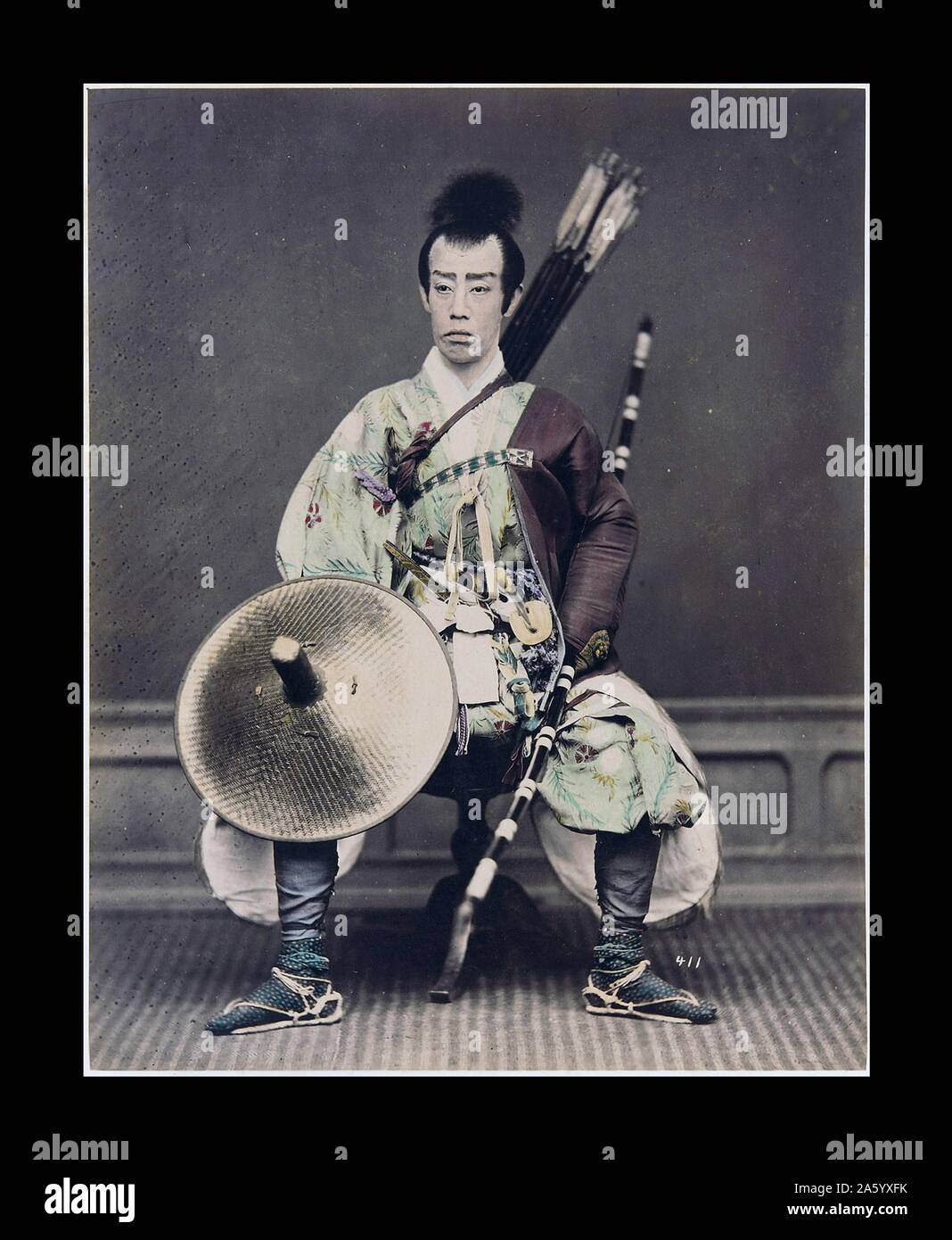 Hand-coloured photograph of a Japanese archer Photographed by Felice Beato (1832-1909) Italian-British photographer. Dated 1880 Stock Photo
