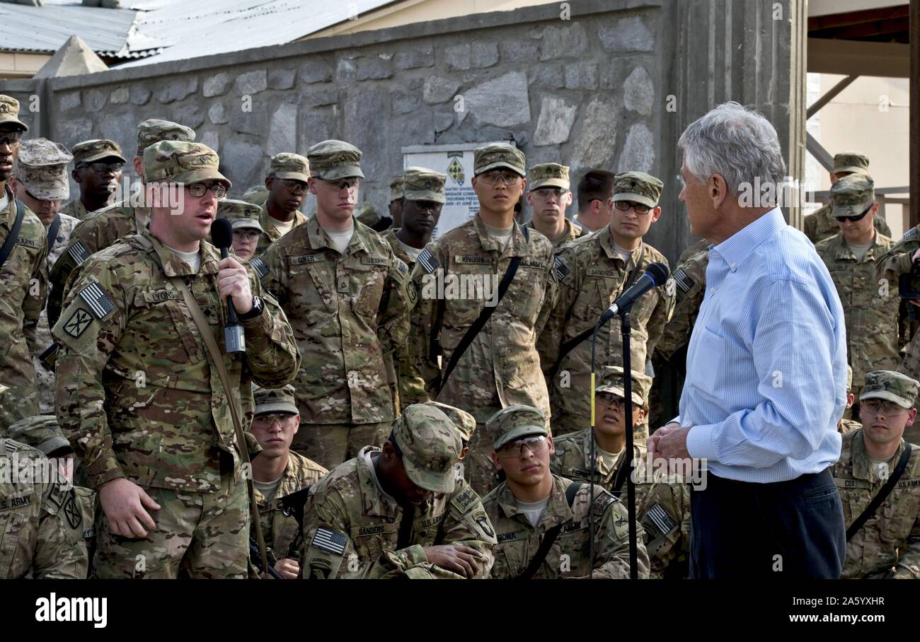 Photograph of United States Secretary of Defense Chuck Hagel (1946-) listening to a question from a U.S. soldier in Jalalabad, Afghanistan. Dated 2013 Stock Photo