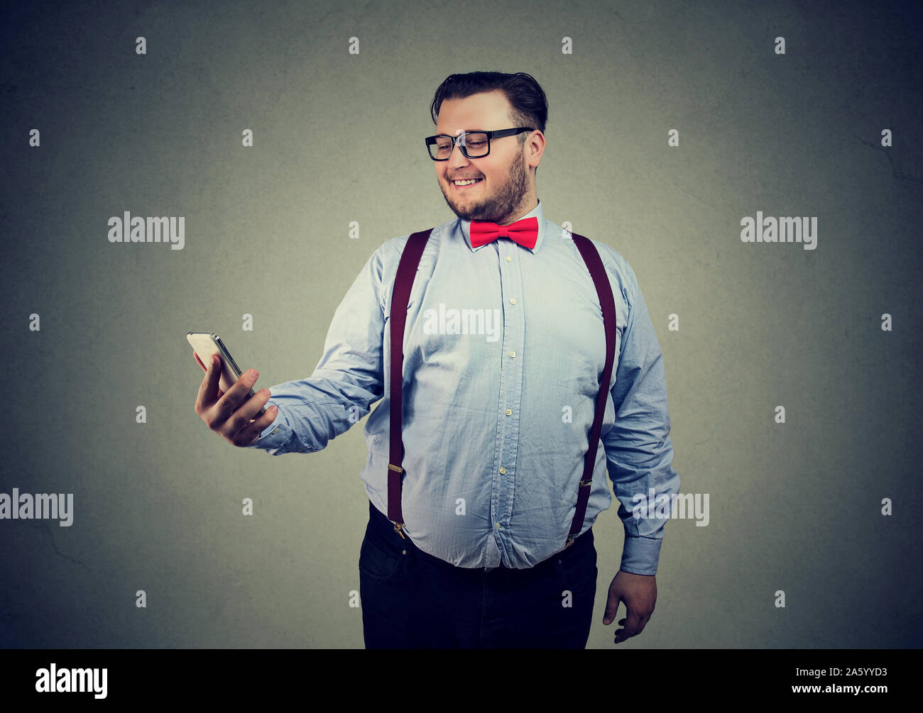 Funny chubby guy taking selfie with cellphone Stock Photo